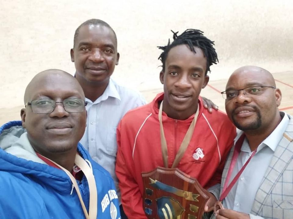 Zimbabwe squash player Innocent Mukumba receiving an award 
