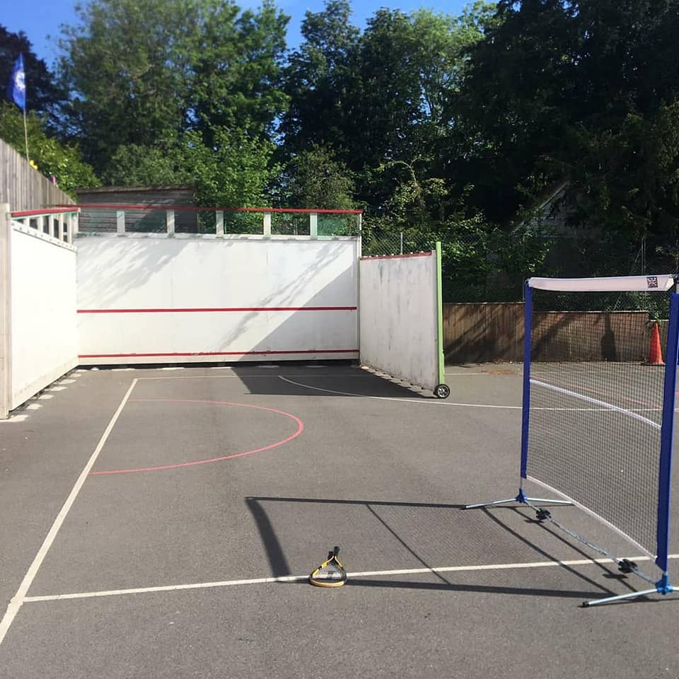 Adapted squash court in school playground UK